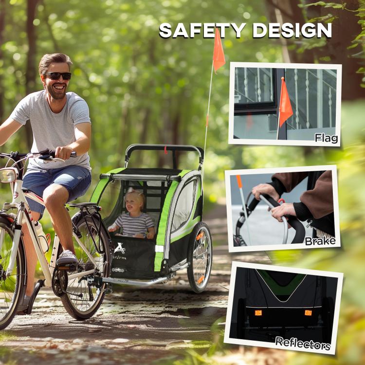 Green double child bike trailer with safety flag, brake, and reflector details