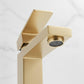Brushed gold faucet spout with visible aerator detail.
