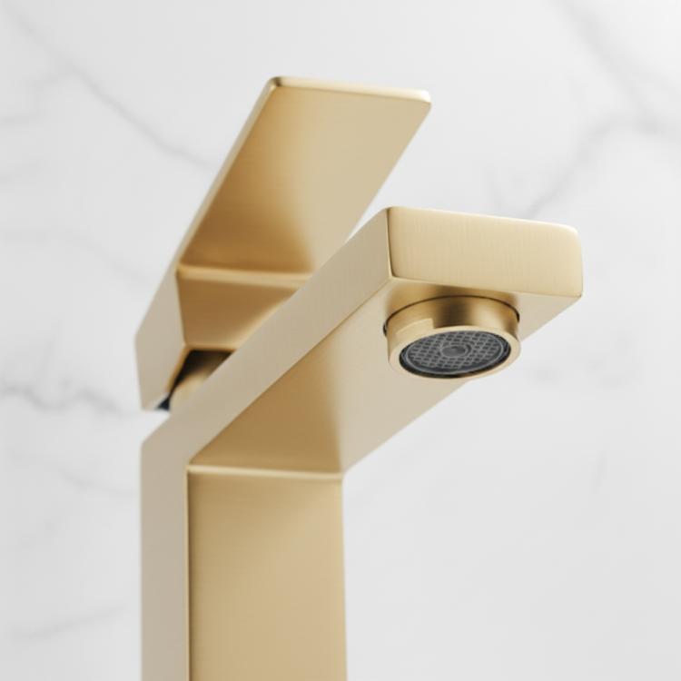 Brushed gold faucet spout with visible aerator detail.