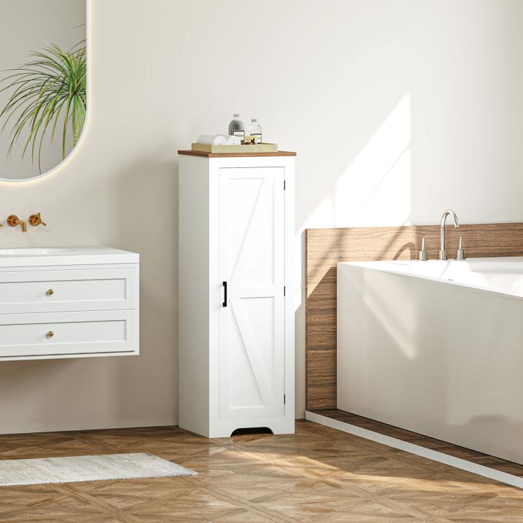 White upright storage cabinet with barn door and black pull handle in a bathroom setting.