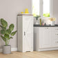 White farmhouse storage cabinet with barn-style door and black handle, kitchen corner view.