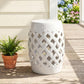 White ceramic garden stool with glazed lattice cutouts and a round perforated top.