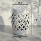 White ceramic garden stool with lattice cutouts and perforated top, 17.9 in tall.