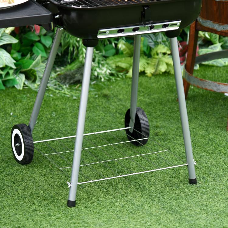 Charcoal barbecue grill with portable wheels and wire lower shelf, front view
