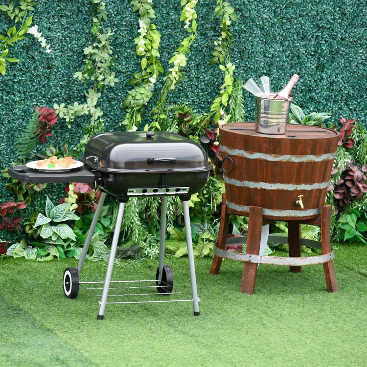 Charcoal barbecue grill on wheeled legs with side shelf and domed lid