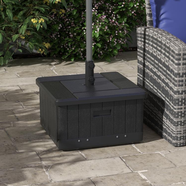 Black outdoor umbrella base with planter box, umbrella stand and side handle on patio