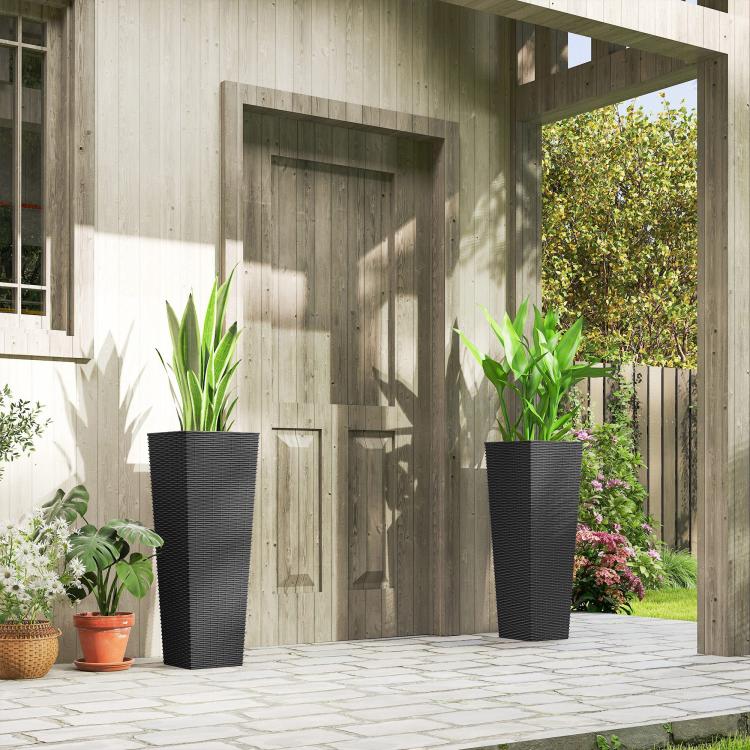 Set of 2 tall black outdoor planters with rattan-style texture, on patio paving