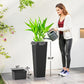 Tall black plastic planters with rattan texture, watering can beside planted pot