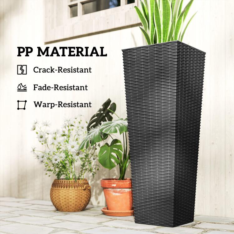 Tall black rattan-texture planter with small plant pots in front