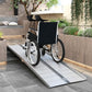 Aluminum wheelchair ramp over steps with ribbed non-slip surface and side rails
