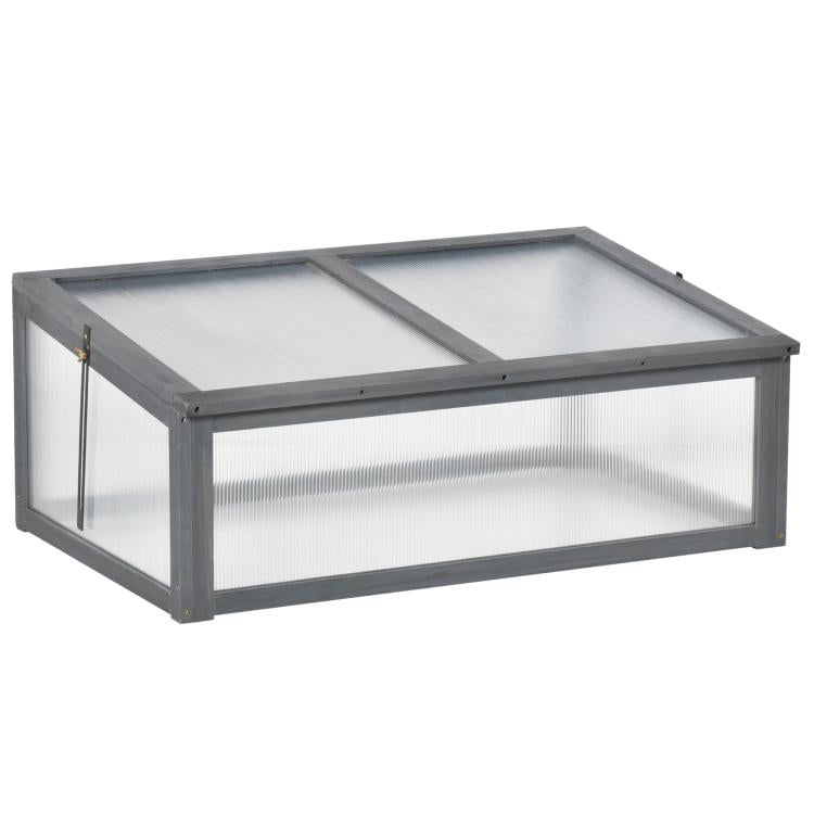 Mini cold frame greenhouse with gray frame and translucent polycarbonate panels, closed lid