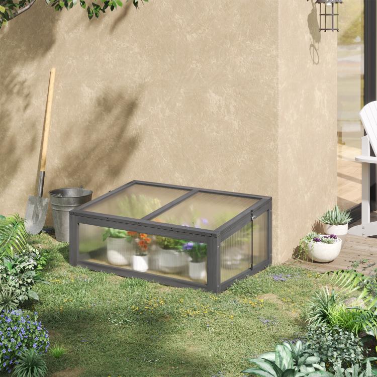 Gray mini cold frame greenhouse with clear polycarbonate panels and slanted open lid
