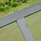 Gray wood frame corner with transparent polycarbonate panel and ridged glazing