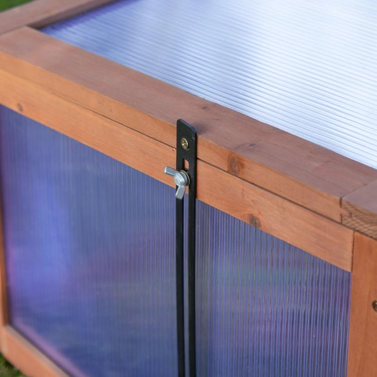 Mini wooden cold frame greenhouse latch and support bar on clear polycarbonate panel