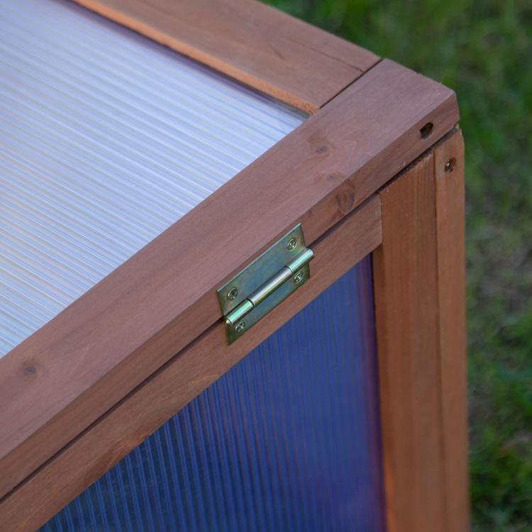 Wooden cold frame greenhouse hinge and latch on the polycarbonate cover