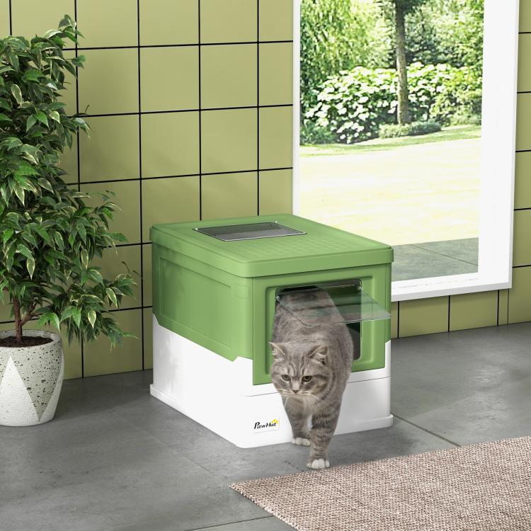 Enclosed cat litter box, green lid and white base, front entry with cat