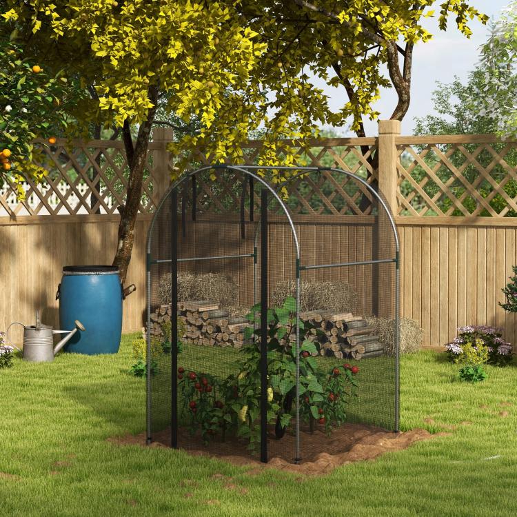 Galvanized steel plant protection tent with black frame and mesh panels in a garden bed
