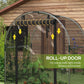 Black roll-up door on galvanized plant protection tent with arched mesh frame