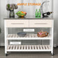 White kitchen island cart with drawers and two open shelves, stocked with kitchen items