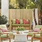 Natural bamboo slat privacy fence screen along patio seating area