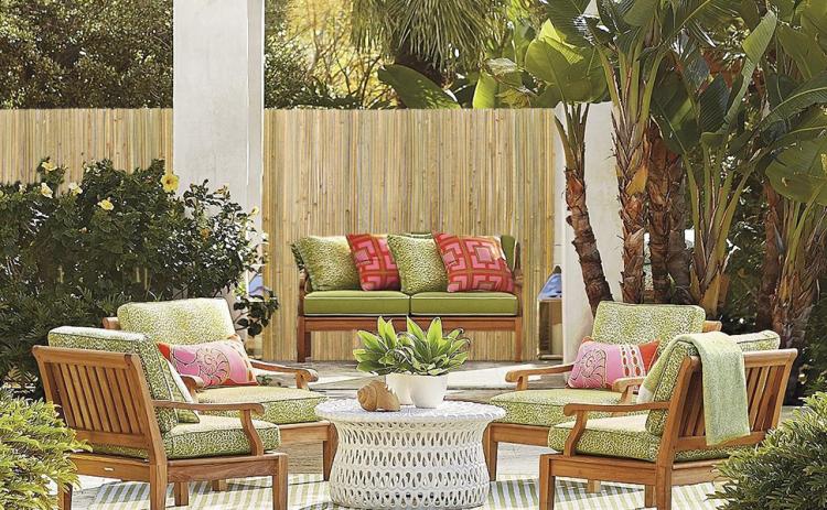 Natural bamboo privacy fence screen behind an outdoor patio seating area