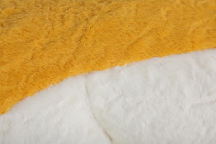 Oversized bean bag chair with yellow faux fur edge and white faux fur surface
