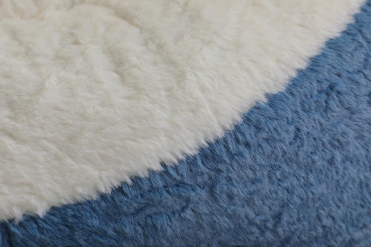 Oversized bean bag chair corner with white faux fur and blue faux fur trim