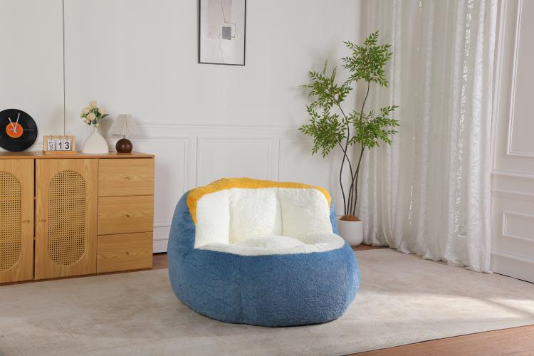 Oversized bean bag chair with blue faux fur body, white seat, and yellow top edge