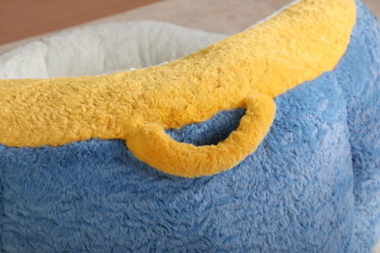 Faux fur bean bag chair arm detail, yellow trim and blue plush with curved seam