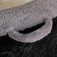 Close-up of gray faux fur trim and black side panel on bean bag chair