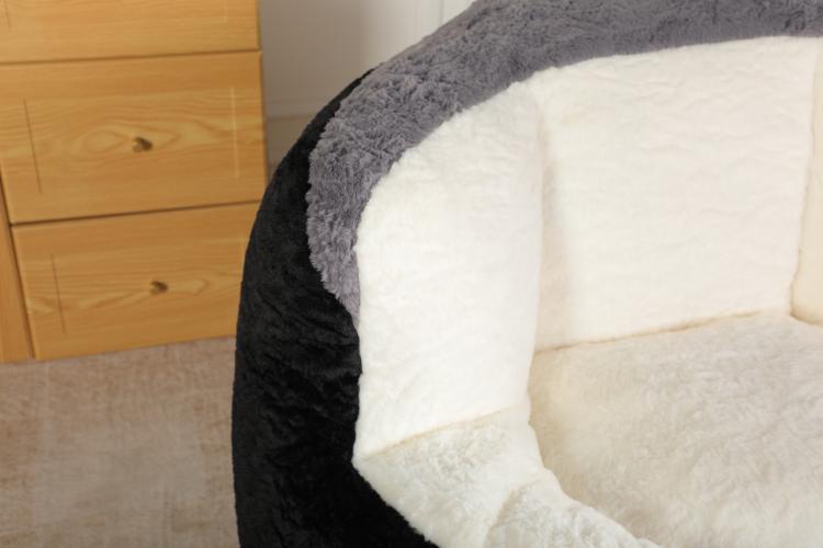 Bean bag chair corner with black faux fur exterior and white padded seat