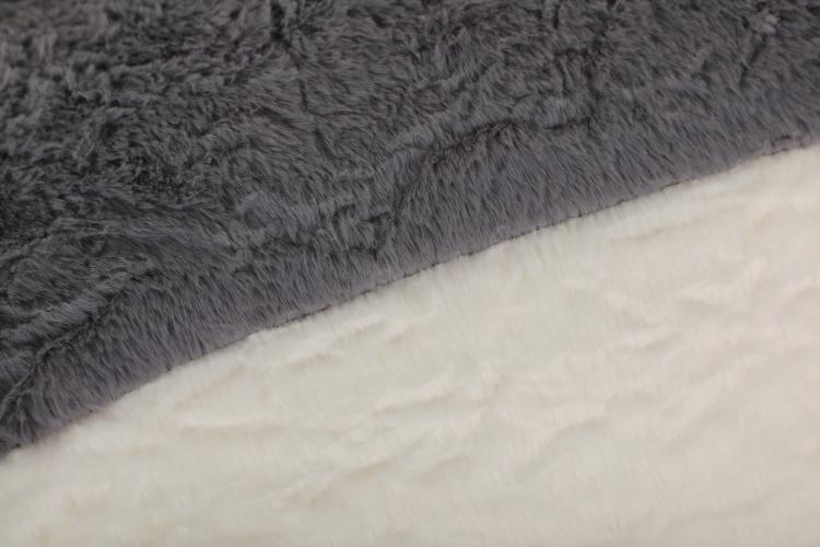 Gray plush faux fur top cushion of bean bag chair with white inner padding