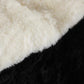 White plush faux fur cushion detail on black bean bag chair