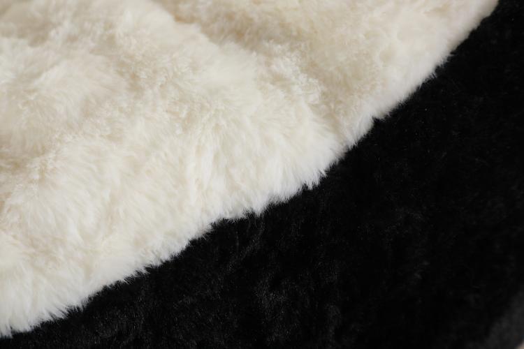 White plush faux fur cushion detail on black bean bag chair