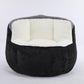 Oversized bean bag chair in black faux fur with white cushioned center