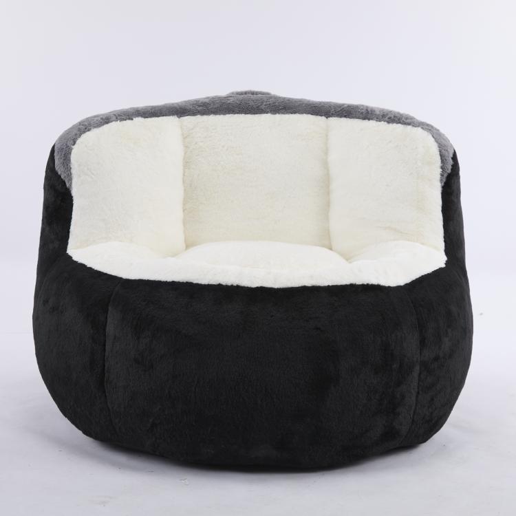 Oversized bean bag chair in black faux fur with white cushioned center