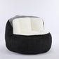 Oversized bean bag chair, black exterior with white inner cushion and gray rim