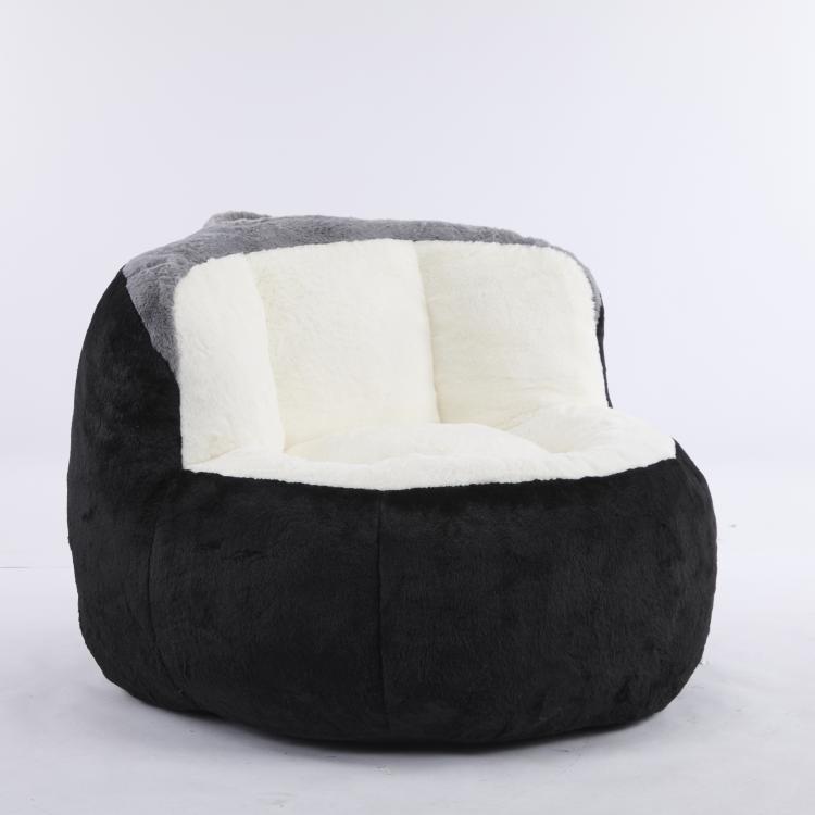 Oversized bean bag chair, black exterior with white inner cushion and gray rim