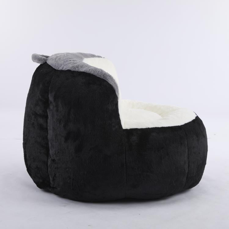 Oversized bean bag chair in black faux fur with gray rolled edge and white cushion
