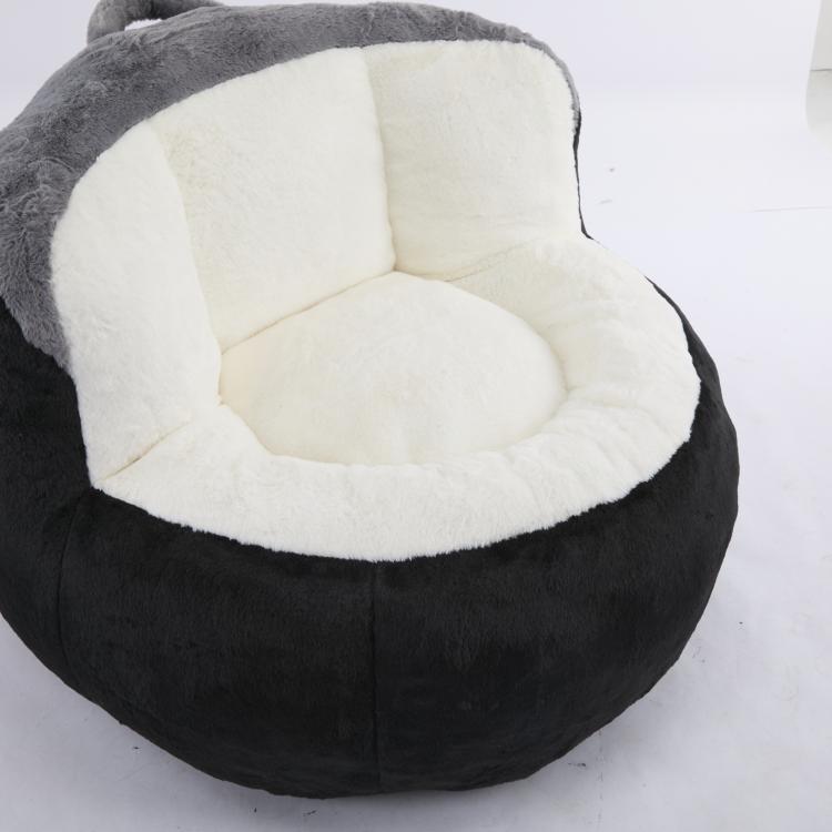 Oversized bean bag chair, black faux fur with white inner seat and gray rim