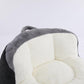 Oversized bean bag chair with gray exterior and white inner cushions