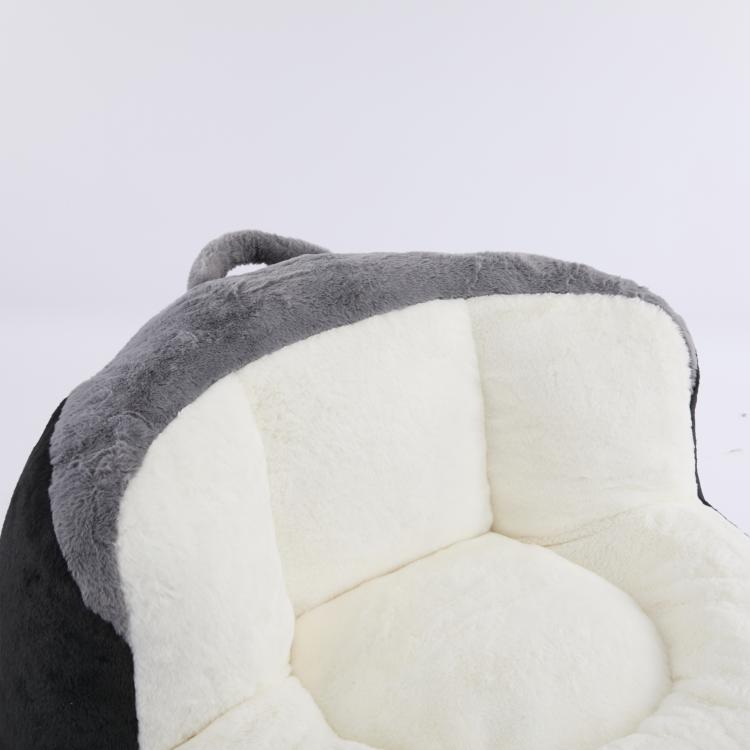 Oversized bean bag chair with gray exterior and white inner cushions
