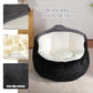 Black faux fur bean bag chair with white inner seat, close-up details view