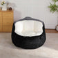 Black faux fur oversized bean bag chair with white inner seat cushion, front view