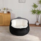 Black faux fur bean bag chair with white inner seat, angled view from front-right
