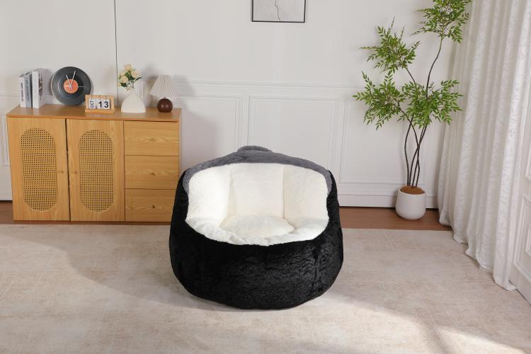 Black faux fur bean bag chair with white inner seat, angled view from front-right