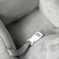 Grey plush elephant seat with safety strap and buckles