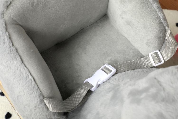 Grey plush elephant seat with safety strap and buckles