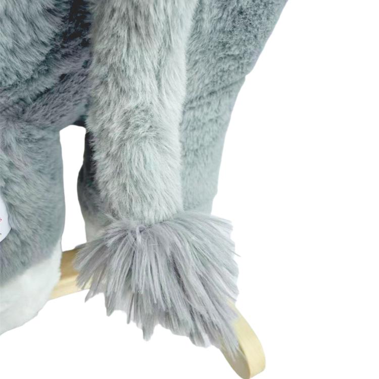Plush elephant tail and shaggy detail on grey rocking horse