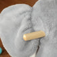 Grey plush elephant rocking toy wooden handle detail on the rocker